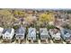 Aerial view of a neighborhood showcasing well-maintained homes, mature trees, and neatly landscaped yards at 711 Virginia Ave, Raleigh, NC 27604