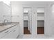 Beautiful bathroom with a single vanity and marble tile flooring, a stylish and functional space at 711 Virginia Ave, Raleigh, NC 27604