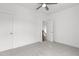 A cozy bedroom with neutral carpet and ceiling fan is ready for your personal touches at 711 Virginia Ave, Raleigh, NC 27604