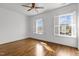 Bright, empty bedroom with natural light, hardwood floors, and white shutters at 711 Virginia Ave, Raleigh, NC 27604