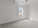 Bright bedroom featuring neutral carpet, allowing for various decor styles and furniture at 711 Virginia Ave, Raleigh, NC 27604