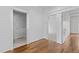 Hallway features hardwood floors, shiplap walls, and stylish doors leading to various rooms at 711 Virginia Ave, Raleigh, NC 27604