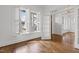 Bright living room with hardwood floors, large windows, and elegant finishes at 711 Virginia Ave, Raleigh, NC 27604
