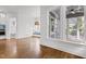Open-concept living space with seamless transitions to the sunroom and kitchen at 711 Virginia Ave, Raleigh, NC 27604