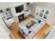 Aerial view showcasing the living room with a fireplace, built-ins, and an open layout to other spaces at 7252 Bedford Ridge Dr, Apex, NC 27539