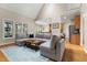 Bright living room boasts a vaulted ceiling, large windows, and an open concept layout to the kitchen at 7252 Bedford Ridge Dr, Apex, NC 27539
