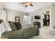 Comfortable main bedroom with walk-in closet and TV, offering a relaxing retreat at 7252 Bedford Ridge Dr, Apex, NC 27539