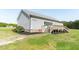 This backyard features a wood deck and lush landscaping at 8079 Stone Heritage Rd, Middlesex, NC 27557
