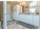 This bathroom features a double sink vanity with ample storage and a decorative rug at 8079 Stone Heritage Rd, Middlesex, NC 27557