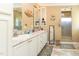 The bathroom showcases a double sink vanity, a stylish shower, and nautical decor at 8079 Stone Heritage Rd, Middlesex, NC 27557