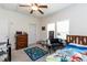 The bedroom has neutral walls, a ceiling fan, and is brightened by a window at 8079 Stone Heritage Rd, Middlesex, NC 27557