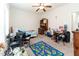 The bedroom has neutral walls, a ceiling fan, and is brightened by a window at 8079 Stone Heritage Rd, Middlesex, NC 27557