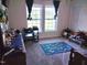 Bright bedroom featuring a playful rug, lots of natural light and ample space at 8079 Stone Heritage Rd, Middlesex, NC 27557