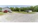 This property features a large gravel parking area and separate storage shed at 8079 Stone Heritage Rd, Middlesex, NC 27557