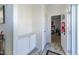 This charming foyer features wood floors and a convenient storage cabinet at 8079 Stone Heritage Rd, Middlesex, NC 27557