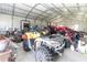 Interior view of garage, showing various vehicles and offering ample space for hobbies at 8079 Stone Heritage Rd, Middlesex, NC 27557