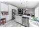 Beautiful kitchen showcasing stainless steel appliances, granite countertops, and wooden floors at 8079 Stone Heritage Rd, Middlesex, NC 27557