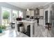 Bright kitchen with an island, stainless steel appliances, granite countertops, and wooden floors at 8079 Stone Heritage Rd, Middlesex, NC 27557