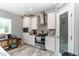 Well-equipped kitchen boasts stainless appliances, granite countertops, a mosaic backsplash, and white cabinetry at 8079 Stone Heritage Rd, Middlesex, NC 27557