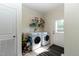 Laundry area complete with side-by-side machines, wire shelf, and exterior access door at 8079 Stone Heritage Rd, Middlesex, NC 27557