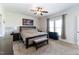 This main bedroom features neutral tones, a ceiling fan, and ample natural light from the double window at 8079 Stone Heritage Rd, Middlesex, NC 27557
