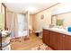 Bathroom featuring a shower-tub combo, single vanity, and neutral walls at 8091 Stone Heritage Rd, Middlesex, NC 27557