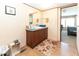 Bathroom with single sink vanity, mirror, and wood-look flooring at 8091 Stone Heritage Rd, Middlesex, NC 27557