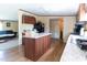 Spacious kitchen featuring an island, neutral countertops and wooden cabinets at 8091 Stone Heritage Rd, Middlesex, NC 27557