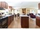Open kitchen features wooden cabinetry, an island and modern appliances at 8091 Stone Heritage Rd, Middlesex, NC 27557
