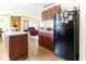 Spacious kitchen with wooden cabinetry, an island and modern appliances at 8091 Stone Heritage Rd, Middlesex, NC 27557