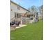 Backyard view of the home, including the deck, screened in porch, and outdoor seating area at 8300 Clarks Branch Dr, Raleigh, NC 27613