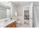 Well-lit bathroom with neutral tones, complete with a tub and shower at 8300 Clarks Branch Dr, Raleigh, NC 27613