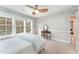 Bright bedroom featuring large windows, a vanity table, and neutral walls for a peaceful and relaxing space at 8300 Clarks Branch Dr, Raleigh, NC 27613