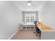 Bright bedroom complete with a built-in day bed and a large desk for work from home at 8300 Clarks Branch Dr, Raleigh, NC 27613