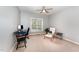 Cozy bedroom featuring a desk, neutral walls and carpet, providing a calm and inviting atmosphere at 8300 Clarks Branch Dr, Raleigh, NC 27613