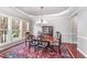 Formal dining room with a chandelier, large window, and classic décor at 8300 Clarks Branch Dr, Raleigh, NC 27613