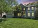 Charming home featuring a mix of stone and shingle siding with a well-manicured lawn at 8300 Clarks Branch Dr, Raleigh, NC 27613