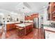 Spacious island kitchen featuring granite countertops, seating, and stainless steel appliances at 8300 Clarks Branch Dr, Raleigh, NC 27613