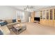 Inviting living room featuring a comfortable couch and custom built in shelving and display area at 8300 Clarks Branch Dr, Raleigh, NC 27613