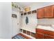 Well-organized mudroom with cubbies, shelving, a sink, and storage at 8300 Clarks Branch Dr, Raleigh, NC 27613