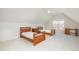 Spacious bedroom with natural light, vaulted ceilings, two beds, and carpet flooring at 9201 Club Hill Dr, Raleigh, NC 27617
