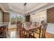 Formal dining area features decorative wallpaper, hardwood floors and natural lighting at 9201 Club Hill Dr, Raleigh, NC 27617