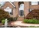 Beautiful brick home with detailed landscaping, a covered porch and a secure entrance at 9201 Club Hill Dr, Raleigh, NC 27617