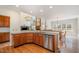 Spacious kitchen with stainless steel appliances, granite counters, and hardwood flooring at 9201 Club Hill Dr, Raleigh, NC 27617