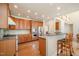 Modern kitchen with granite countertops, stainless steel appliances, and breakfast bar seating at 9201 Club Hill Dr, Raleigh, NC 27617