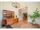 Large home office with hardwood floors, built-in bookshelves, and ample workspace at 9201 Club Hill Dr, Raleigh, NC 27617