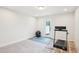 Finished basement area offers versatile space, with a door to the outside, and potential for recreation or storage at 1003 Canary Pepper Dr, Durham, NC 27713