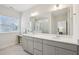 Bathroom features dual sinks, vanity, mirror, and a shower at 1003 Canary Pepper Dr, Durham, NC 27713