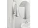 Bright bathroom features a vanity sink and a round mirror at 1003 Canary Pepper Dr, Durham, NC 27713