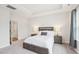 Serene main bedroom with a tray ceiling, soft carpet, and ample natural light at 1003 Canary Pepper Dr, Durham, NC 27713